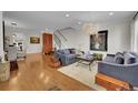 Spacious living room with hardwood floors and ample seating at 538 Madison St, Denver, CO 80206