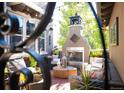 Cozy outdoor patio with fireplace and seating area at 2394 S Loveland Way, Lakewood, CO 80228