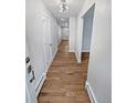 Bright hallway with hardwood floors and access to various rooms at 746 S Poplar St, Denver, CO 80224