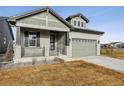 Two-story house with front porch and attached garage at 3051 Newfound Lake Rd, Berthoud, CO 80513