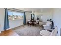 Bright dining area with hardwood floors and large window at 2452 Shetland Trl, Elizabeth, CO 80107