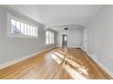 Bright living room featuring hardwood floors and abundant natural light at 2103 S Lafayette St, Denver, CO 80210