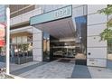 Modern building entrance with glass doors and a covered entryway at 891 14Th St # 1612, Denver, CO 80202