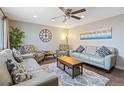 Spacious living room with hardwood floors and ample natural light at 6661 Harlan St, Arvada, CO 80003