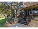 Condo building entrance with stairs and landscaping at 3460 S Poplar St # 307, Denver, CO 80224