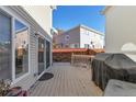 Back deck with built-in grill and view of neighboring houses at 20000 Mitchell Pl # 71, Denver, CO 80249