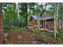 Landscaped yard with a path leading to the home at 120 Windwood Cir, Breckenridge, CO 80424
