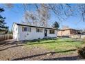 Newly renovated ranch home with a fresh coat of paint and nicely landscaped lawn at 6513 Teller St, Arvada, CO 80003