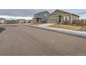 Quiet residential street with houses and well-maintained lawns at 7203 Arkansas St, Frederick, CO 80530