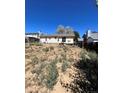 Large backyard with a mostly empty lot at 18064 E Ford Pl, Aurora, CO 80017