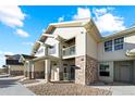 Two-story townhome with balcony and stone at 18633 Stroh Rd # 2-103, Parker, CO 80134