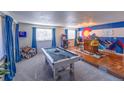 Game room features a pool table, bar area, and Colorado-themed mural at 11008 Vrain Ct, Westminster, CO 80031