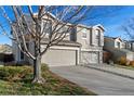 Two-story townhome with attached garage and landscaping at 10980 Columbine St, Northglenn, CO 80233