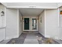 Front entry of townhouse with double doors and walkway at 12675 E Pacific Cir # C, Aurora, CO 80014