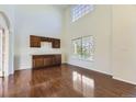 Spacious dining area with built-in cabinetry and hardwood floors at 850 Quarterhorse Trl, Castle Rock, CO 80104