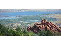 Panoramic view of a lake and red rocks at 10987 Roxborough Dr, Littleton, CO 80125