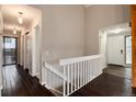 Bright hallway with wood floors and access to upper level at 3779 S Cathay Cir, Aurora, CO 80013