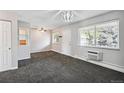 Open living room with neutral walls, carpet, and a ceiling fan at 5995 E Iliff Ave # 307, Denver, CO 80222
