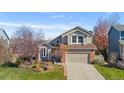 Two-story home with a landscaped front yard at 3469 Starflower Rd, Castle Rock, CO 80109