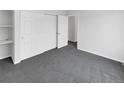 Spacious bedroom with wall-to-wall carpeting and a large closet at 22975 E Ontario Dr # 101, Aurora, CO 80016