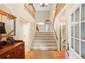 Bright entryway with tiled floor and staircase to upper level at 4505 S Yosemite S St # 371, Denver, CO 80237