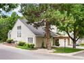 Side view of two-story townhome with mature trees at 4505 S Yosemite S St # 371, Denver, CO 80237