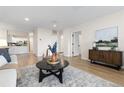 Open concept living room showcasing a stylish coffee table and comfortable seating at 1133 Race St # 1B, Denver, CO 80206