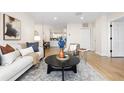 Spacious living area featuring a light and airy atmosphere with comfortable furniture at 1133 Race St # 1B, Denver, CO 80206