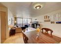 Bright dining area with hardwood floors and city view at 1020 15Th St # 9E, Denver, CO 80202