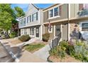 Front view of a two story townhome with landscaping at 8140 S Fillmore Cir, Centennial, CO 80122
