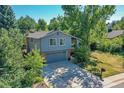 Two-story home with a spacious yard and two-car garage at 6034 S Niagara Ct, Centennial, CO 80111