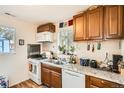 Practical kitchen featuring wood cabinetry, granite countertops, and essential appliances at 710 N Raleigh St, Denver, CO 80204