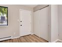 Condo entryway with coat closet and wood-look flooring at 3575 28Th St # 102, Boulder, CO 80301