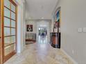 Bright and spacious entryway with elegant tile flooring and art at 9022 Jason Ct, Boulder, CO 80303