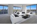 Living room with city views, staged with modern furniture at 3100 E Cherry Creek Drive South S Dr # 501, Denver, CO 80209