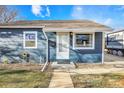 Blue house with a white door and small front yard at 8881 Hoyt Dr, Thornton, CO 80229