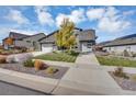 Two-story home with gray stone and modern design at 8321 Estes Park Ave, Littleton, CO 80125