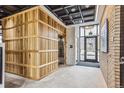Stylish lobby with wood elevator enclosure and brick accent wall at 3575 Chestnut Pl # 606, Denver, CO 80216