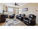 Spacious living room with fireplace, large windows and comfortable seating at 5703 N Gibralter Way # 204, Aurora, CO 80019