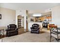 Open concept kitchen with island and stainless steel appliances at 5703 N Gibralter Way # 204, Aurora, CO 80019