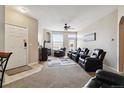 Spacious living room with fireplace, large windows and comfortable seating at 5703 N Gibralter Way # 204, Aurora, CO 80019