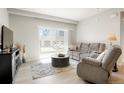 Spacious living room with sliding door to patio at 15700 E Jamison Dr # 8-103, Englewood, CO 80112