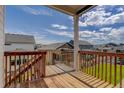 Wooden deck overlooking backyard and neighboring houses at 5072 Ditmars Ln, Castle Rock, CO 80104