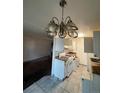 Kitchen features white cabinets, granite countertops, and a stove at 10732 E Exposition Ave # 222, Aurora, CO 80012