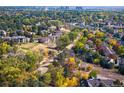 Aerial shot showcasing community and surrounding autumn foliage at 1355 S Ulster St, Denver, CO 80231