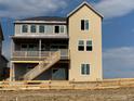 Two-story house with a large deck and fenced backyard at 9334 Quartz St, Arvada, CO 80007