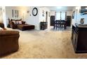 Spacious living room features a comfortable sectional sofa and dining area at 13714 Omega Cir, Lone Tree, CO 80124