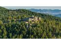 Mountaintop estate offering stunning views and private setting at 24503 Chris Dr, Evergreen, CO 80439