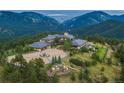 Luxury home with mountain views, expansive grounds, and a large motor court at 24503 Chris Dr, Evergreen, CO 80439