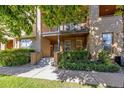 Attractive exterior of a townhome with landscaping and a walkway at 427 S Quay St, Lakewood, CO 80226